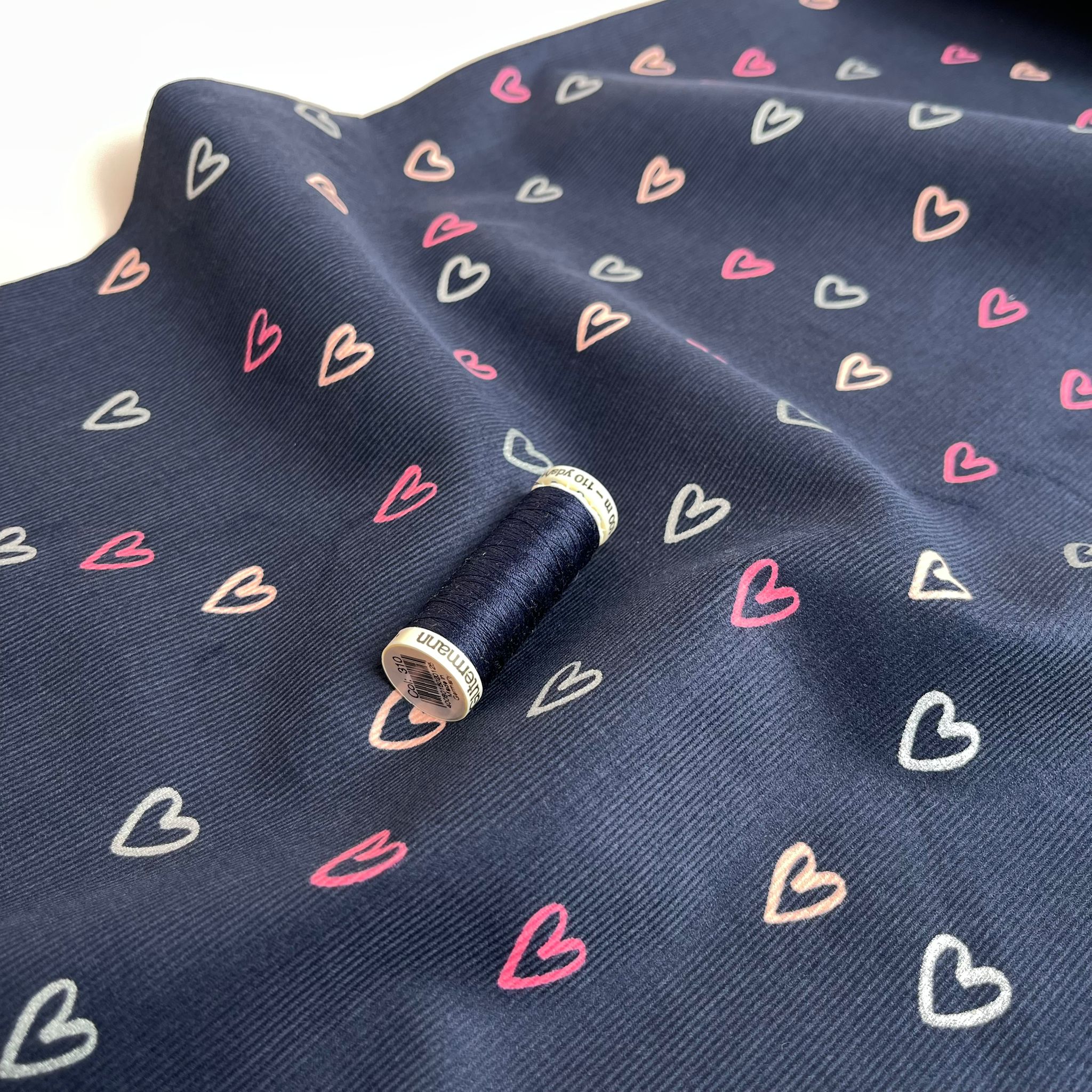 Shimmer Hearts on Navy Cotton Needlecord