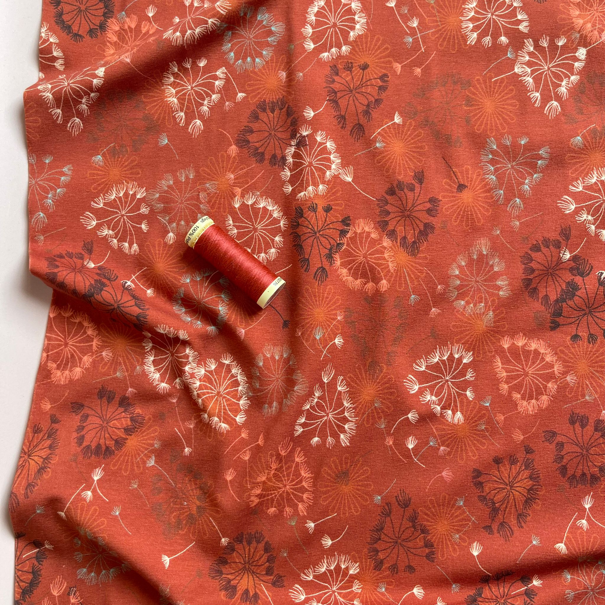 Danish Design - Dandelion on Rust Cotton Jersey Fabric