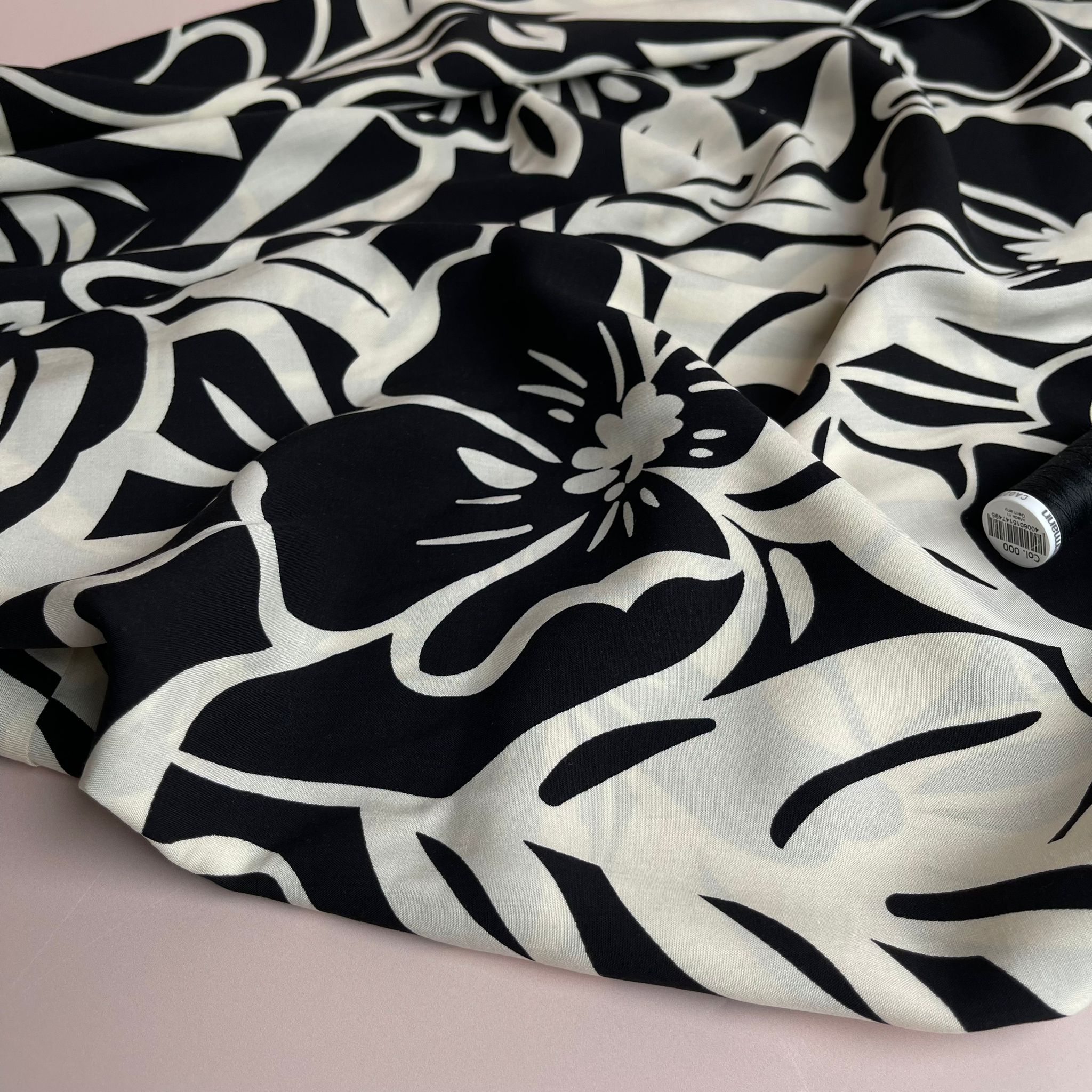 Off-White Blooms on Black Viscose Fabric