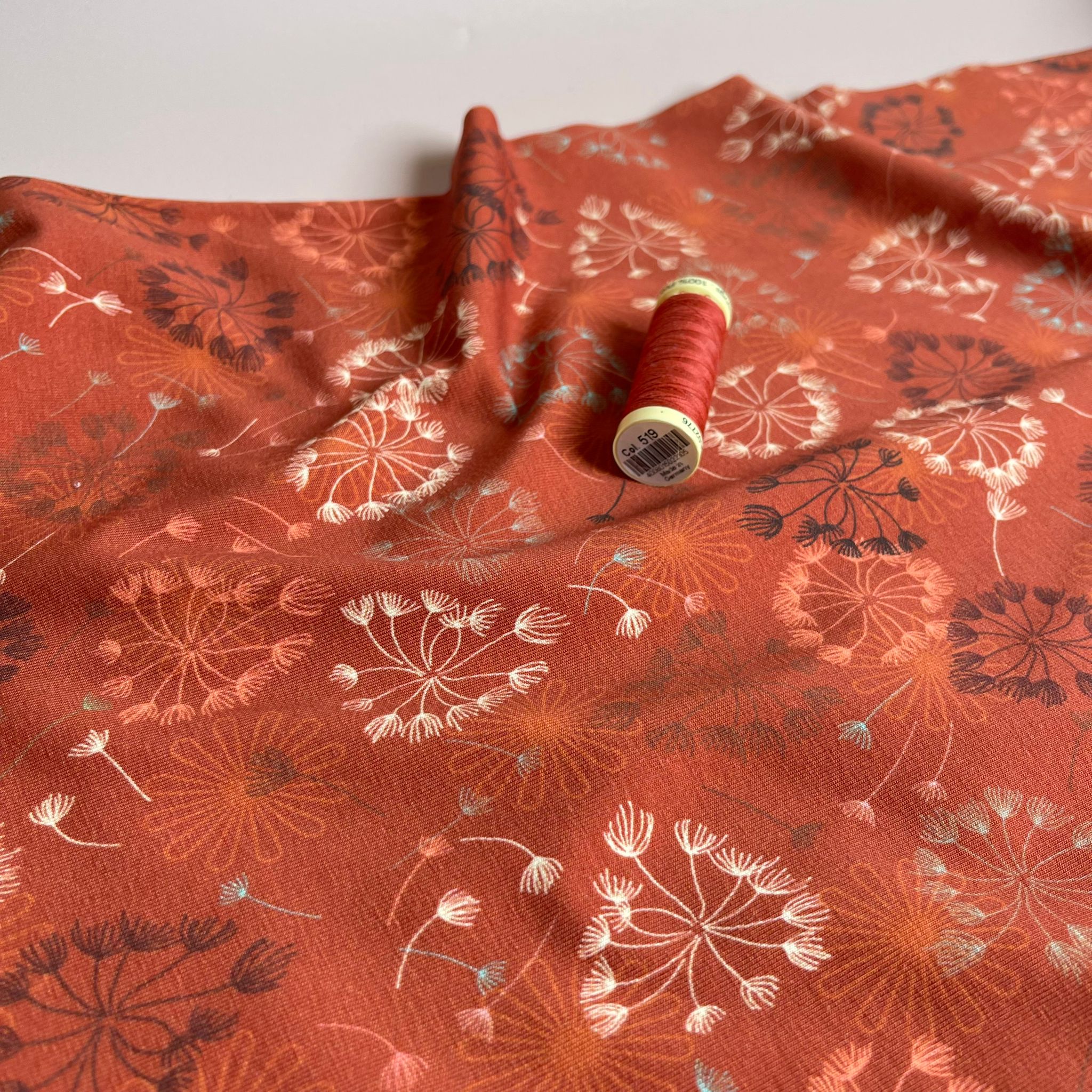 Danish Design - Dandelion on Rust Cotton Jersey Fabric