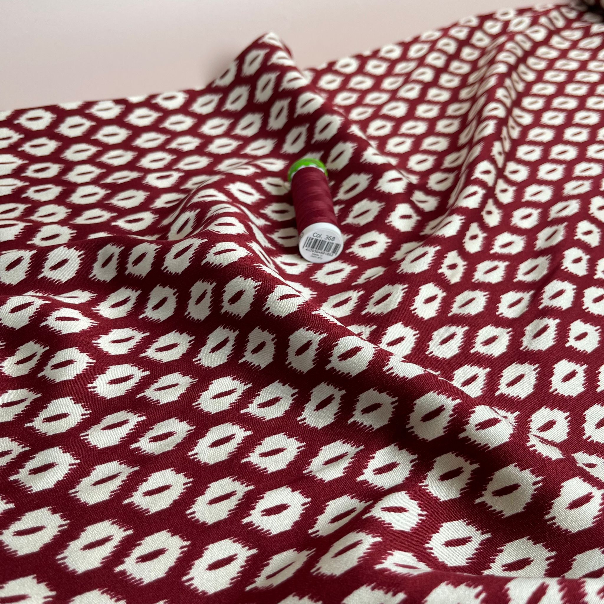 REMNANT 1.79 Metres (plus extra section with slight fading)  - Abstract Rhombus on Burgundy Viscose Twill Sateen Fabric