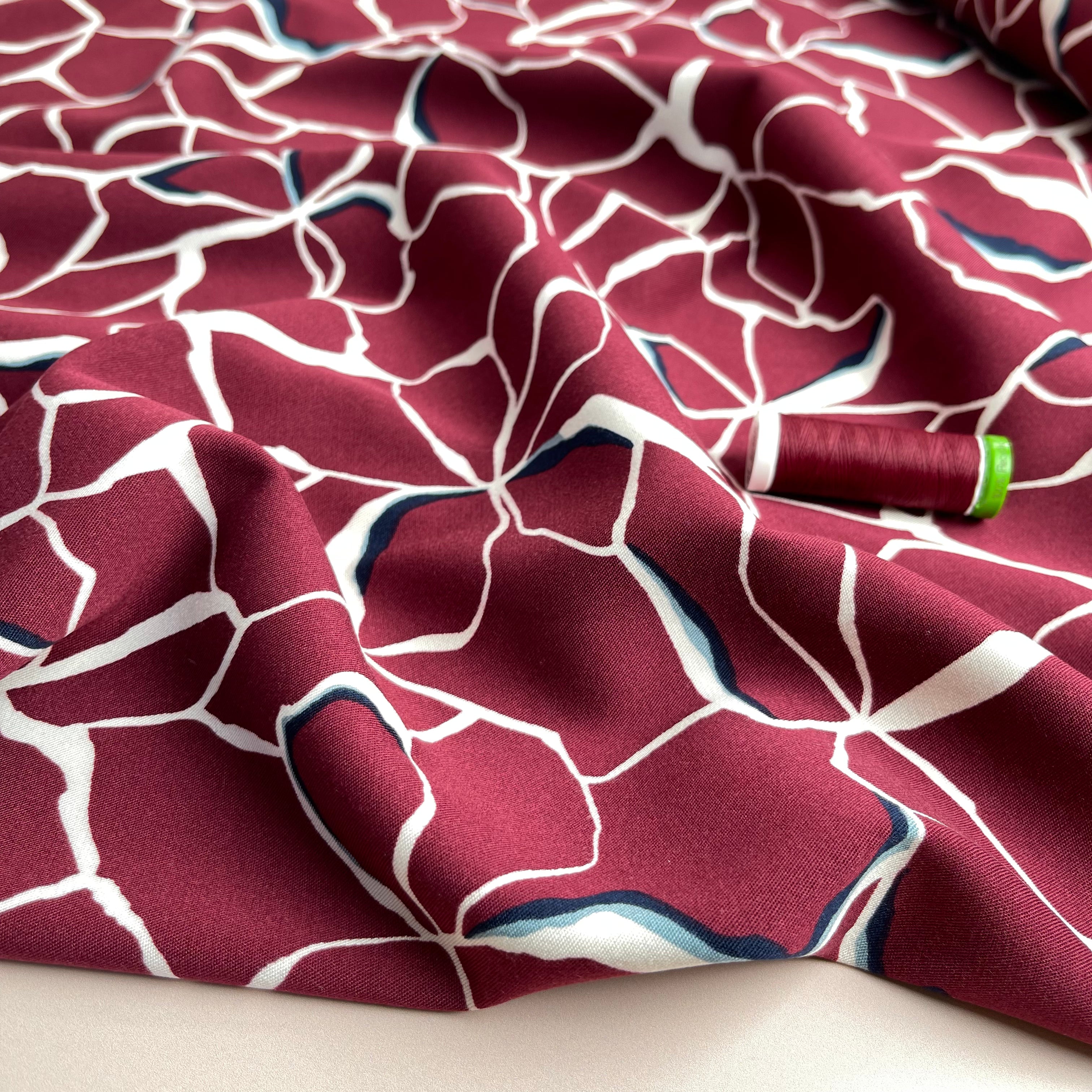 Rosella Line Flowers in Berry Stretch Viscose Twill Fabric