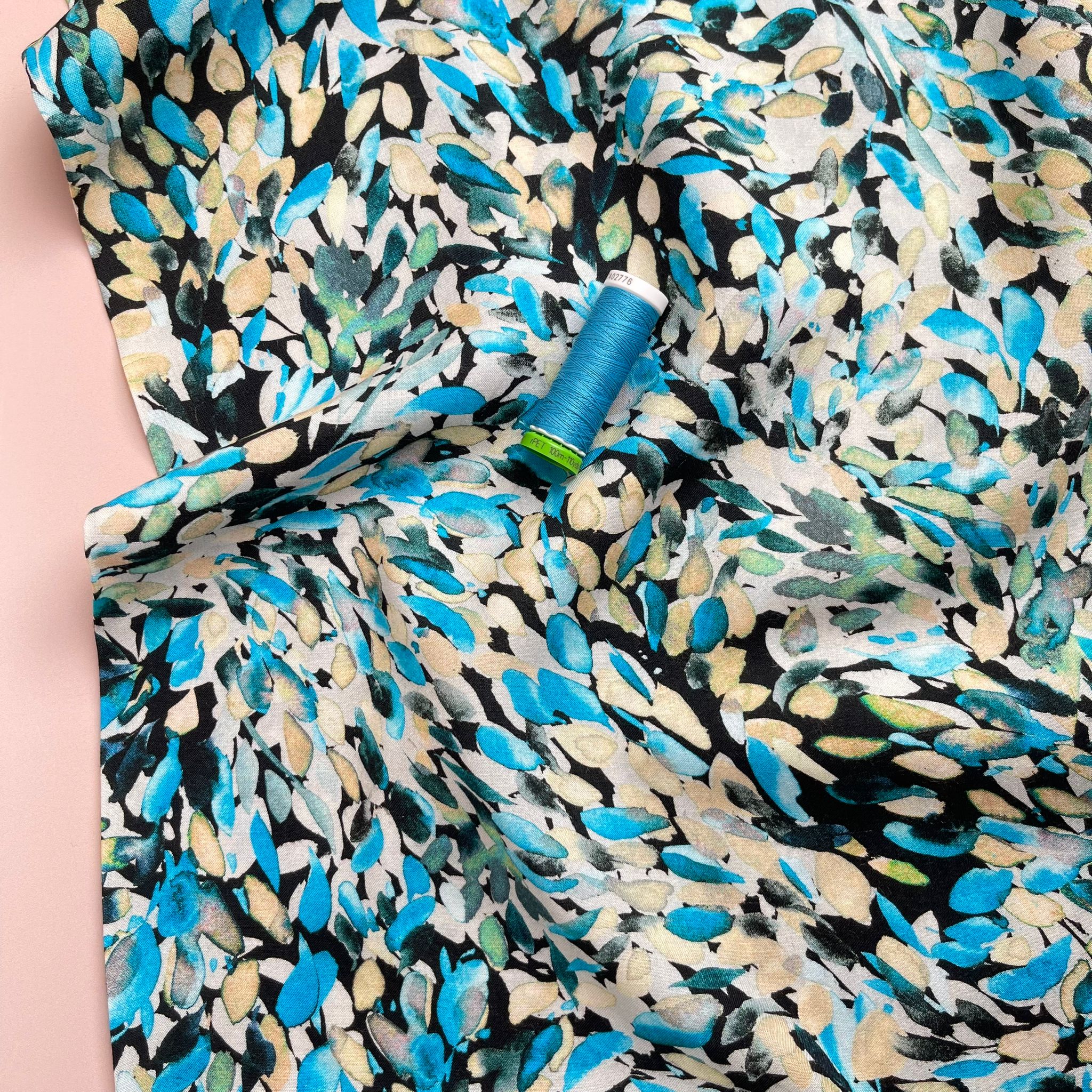 Falling Petals in Turquoise Viscose Fabric