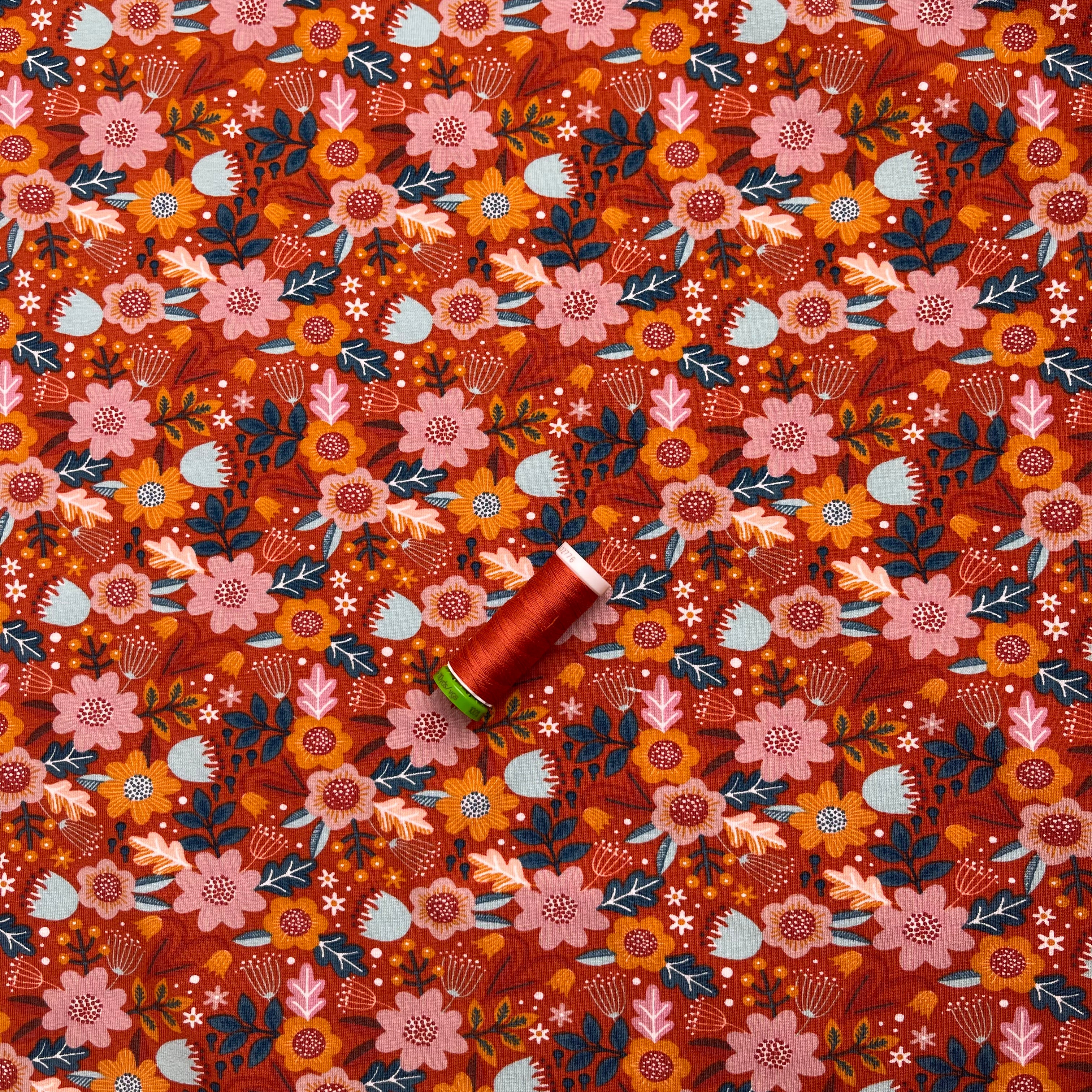 Flowers on Burnt Orange GOTS Organic Cotton Jersey Fabric