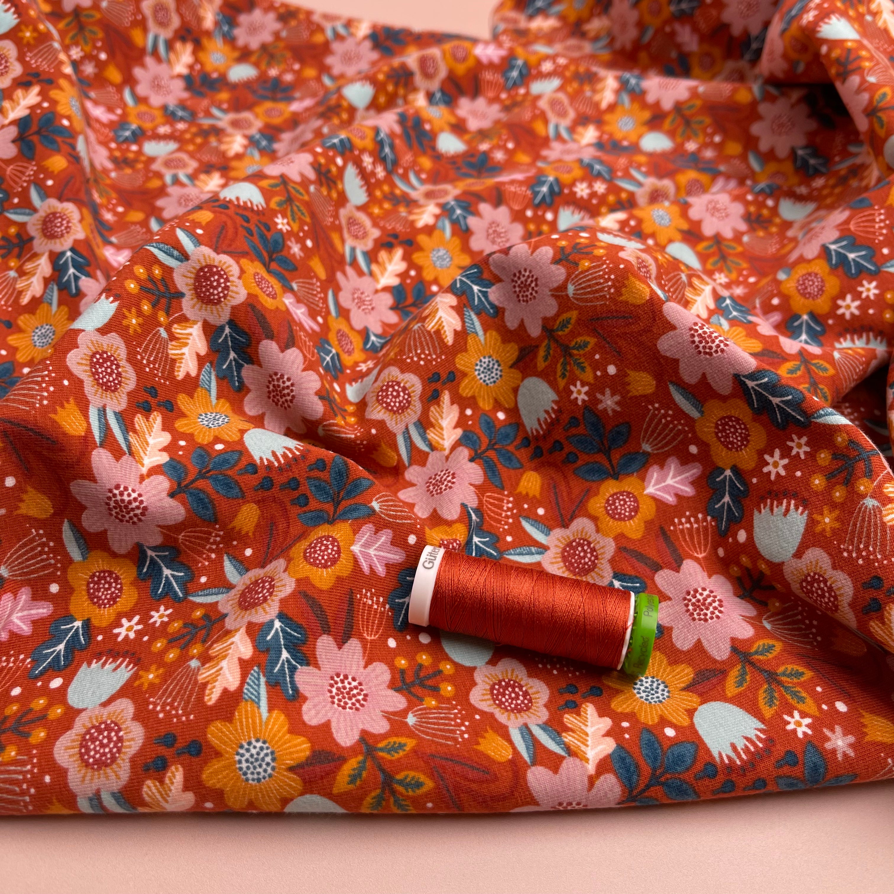 Flowers on Burnt Orange GOTS Organic Cotton Jersey Fabric