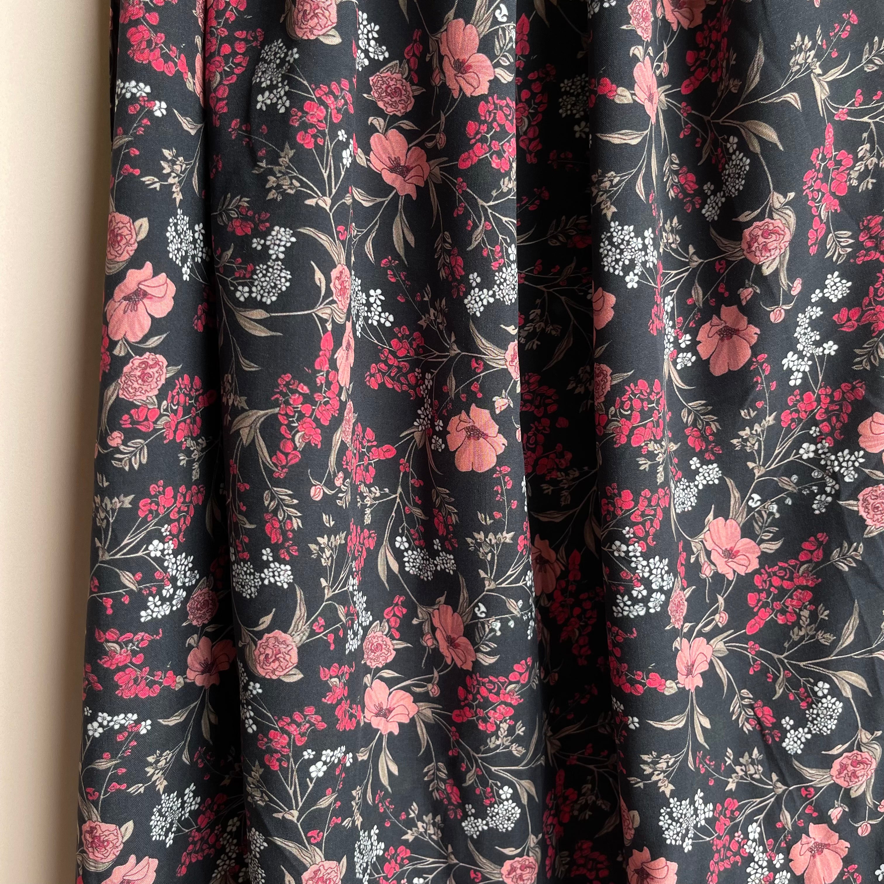 Elegant Blooms on Black Viscose Fabric