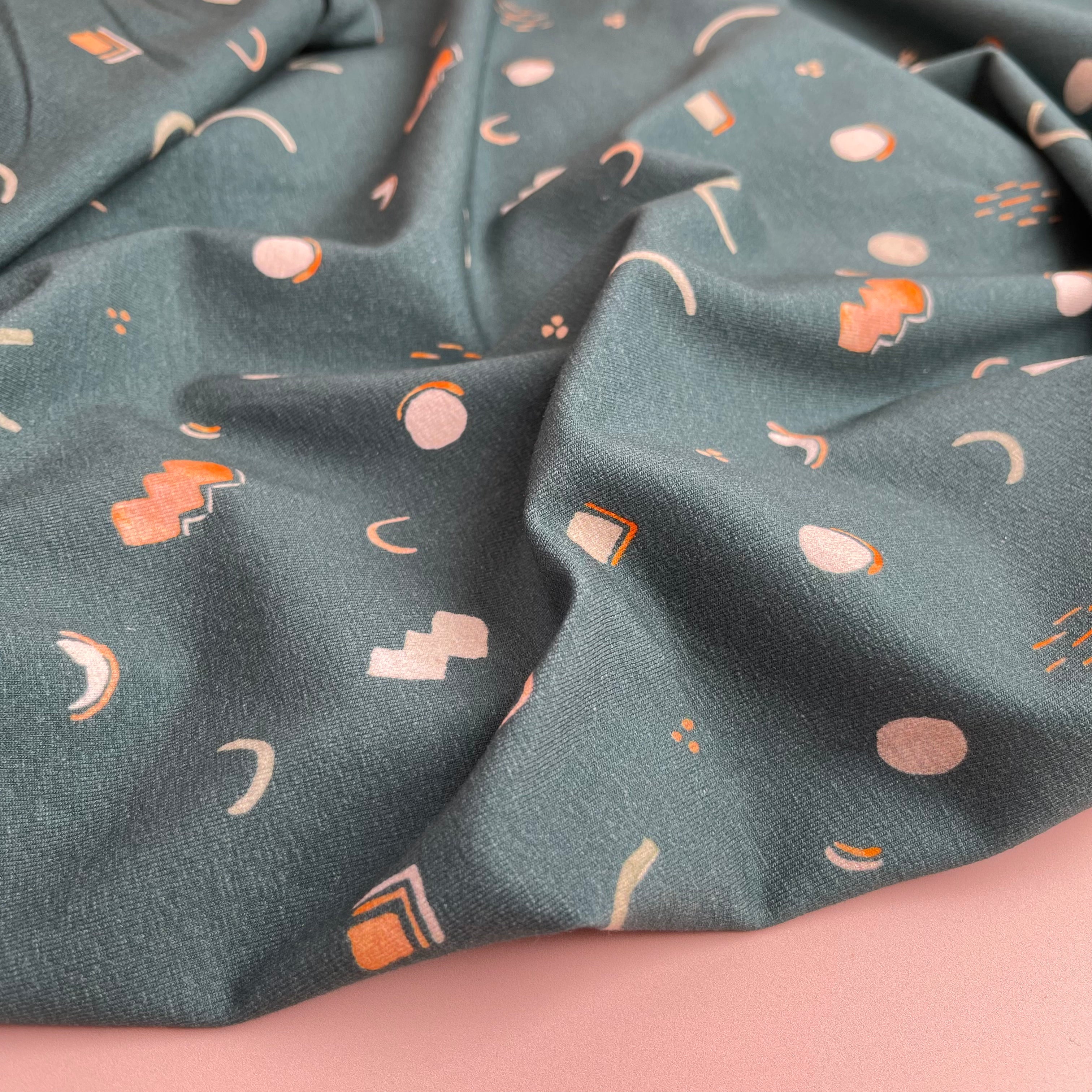 Graphic Shapes on Green Cotton Jersey Fabric
