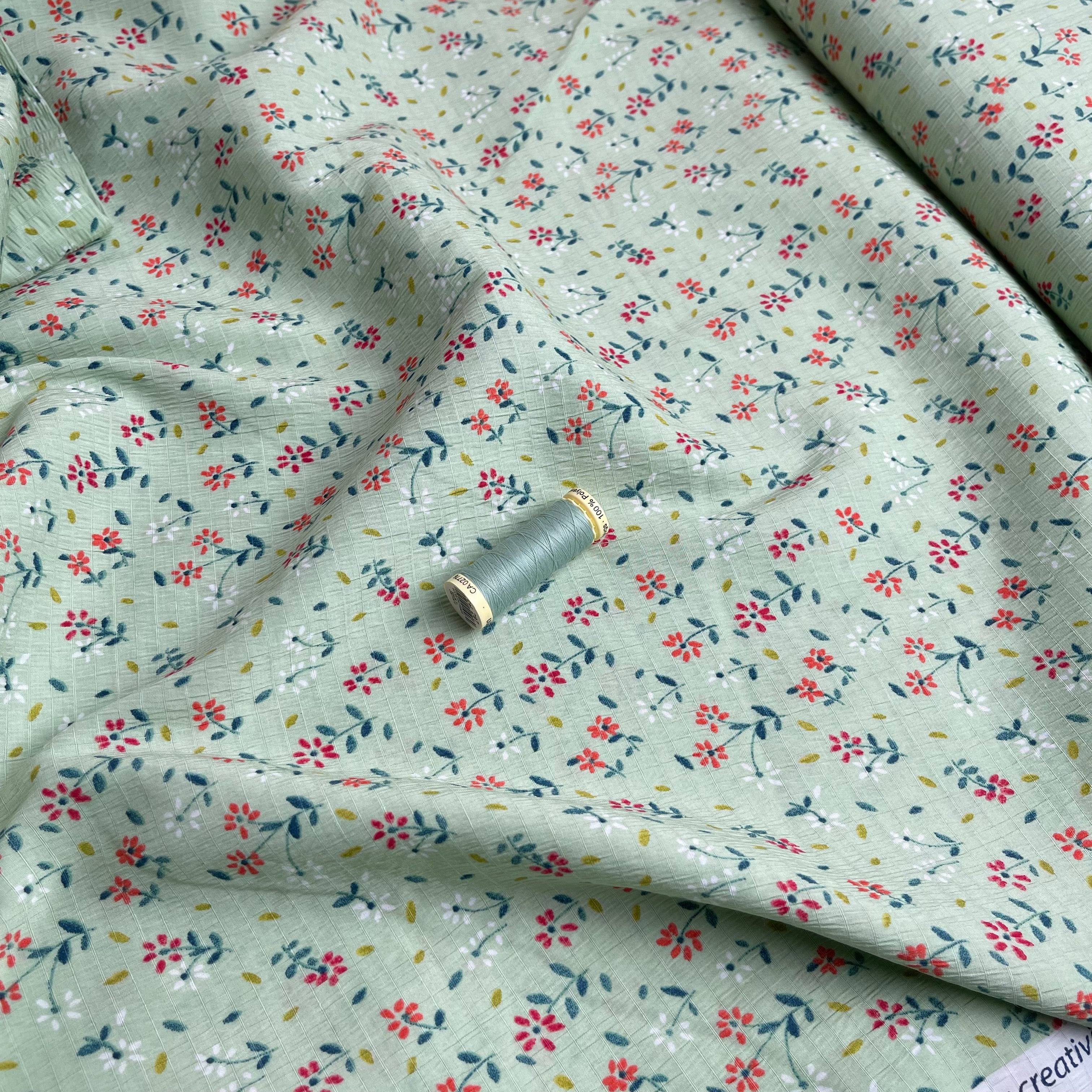 REMNANT 0.97 Metre - Ditsy Petals on Spring Green Viscose Seersucker Fabric